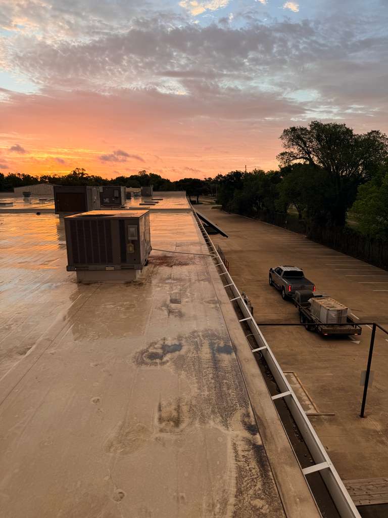 Golden hour on a commercial rooftop job site